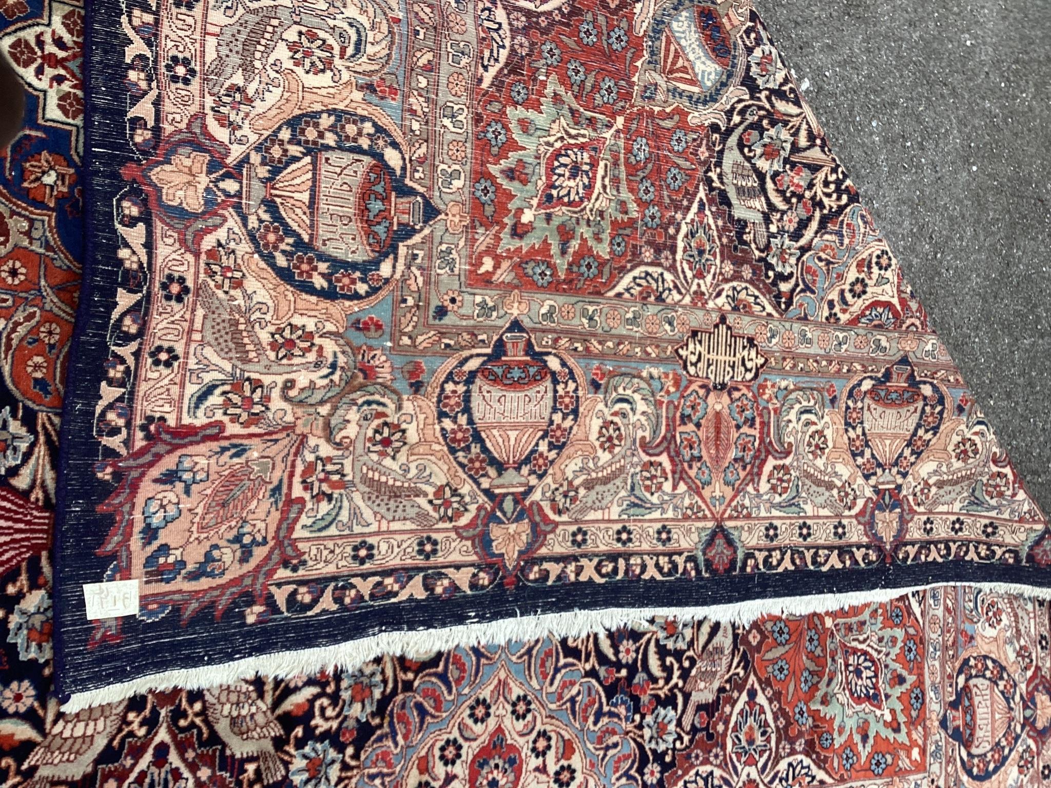 A Tabriz blue ground carpet, 390 x 290cm
